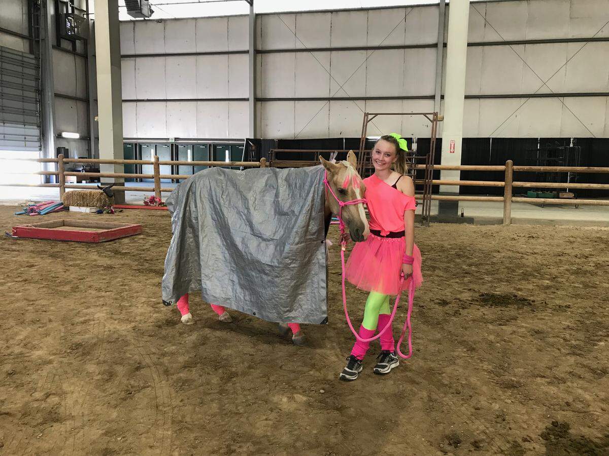 Zhatanna Vincent poses with her mustang, Macee, in their outfits for the freestyle portion of the 2018 Mustang Mania Training Incentive Program. Zhatanna and Macee won first place overall, as well as first place in the freestyle portion.
