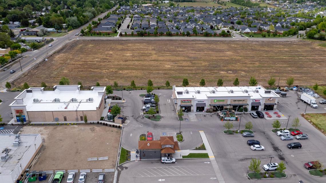 There are some commercial uses at the intersection of Five Mile and Lake Hazel roads, including an Albertsons, pizza shop, McDonald’s and an Idaho Central Credit Union. This south-facing aerial image shows the vacant parcel at top and a few stores at bottom.