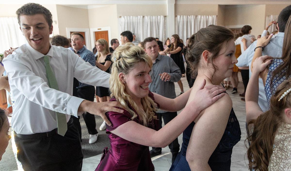 Students dance in a train formation during VIP Prom on Saturday at Potomac Manor Event Center.