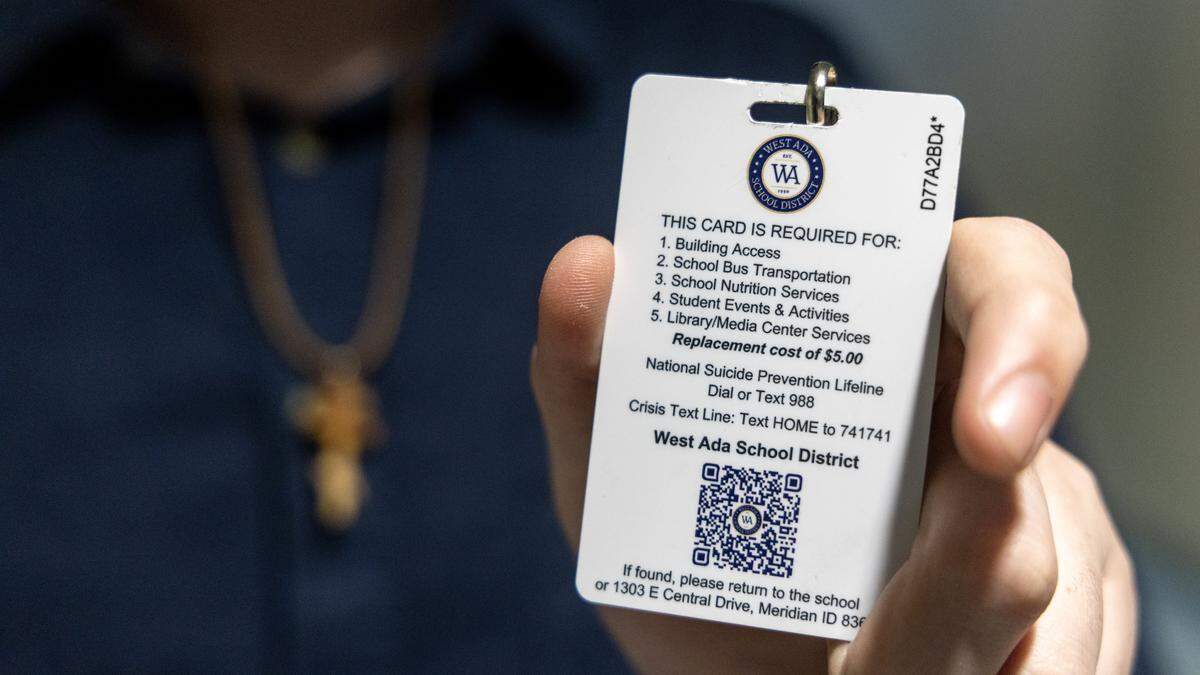 The backside of a West Ada School District student badge provides information on accessing help through calling or texting a suicide prevention hotline. 