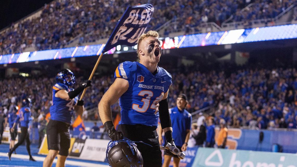 Boise State safety Alexander Teubner carries the hammer at the Broncos enter Albertsons Stadium on Saturday, Oct. 8, 2022 for their game against Fresno State.