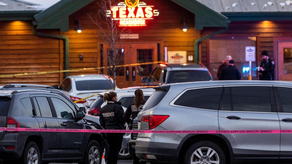 Police gather evidence in the parking lot of Texas Roadhouse restaurant in Meridian, where Boise Police say a man wanted on felony charges was shot and killed by an officer during the arrest, Monday, Jan. 23, 2023.