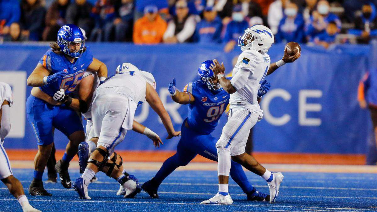 Boise State defensive tackle Ahmed Hassanein (91) closes in on Air Force quarterback Haaziq Daniels during a game at Albertsons Stadium last season. The former CrossFit star has two sacks this season.
