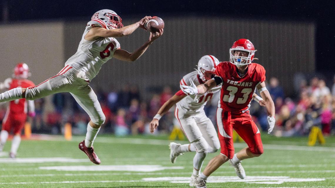 Weiser’s Kolin Cook leaps for an interception against Homedale last fall.