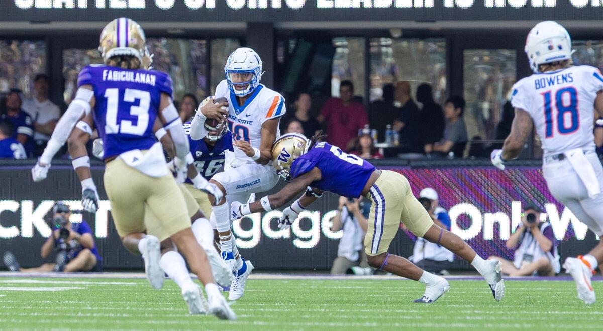 Boise State quarterback Taylen Green keeps the ball for a gain of 11 yards in the third quarter of their game against University of Washington at Husky Stadium in Seattle, Saturday, Sept. 2, 2023.