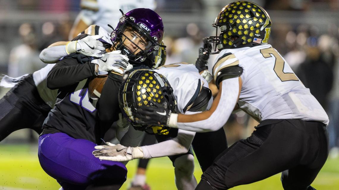 Rocky Mountain’s Kaplan Custer is stopped by a trio of Kuna players in the fourth quarter Friday.