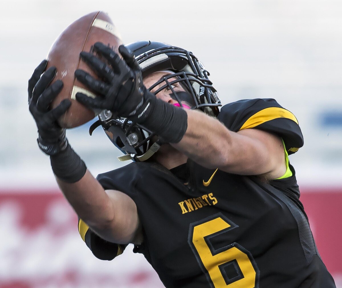 Bishop Kelly wide receiver Dan Marlow pulls in a long pass for a first down against Hillcrest in the 4A state football championship Saturday, Nov. 17, 2018 at Albertsons Stadium in Boise.