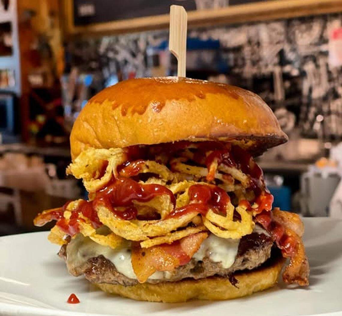 The colossal Cherry Bomb ($16.79 with french fries) will be the feature hamburger for Nampa’s Holy Cow Idaho during May.