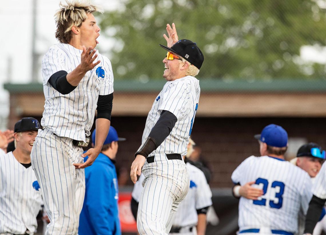 Timberline’s Greyson Shafer and Max Spielman celebrate after winning the 5A baseball state championship game against Eagle at Wolfe Field in Caldwell on Saturday. Timberline beat Eagle 12-4.
