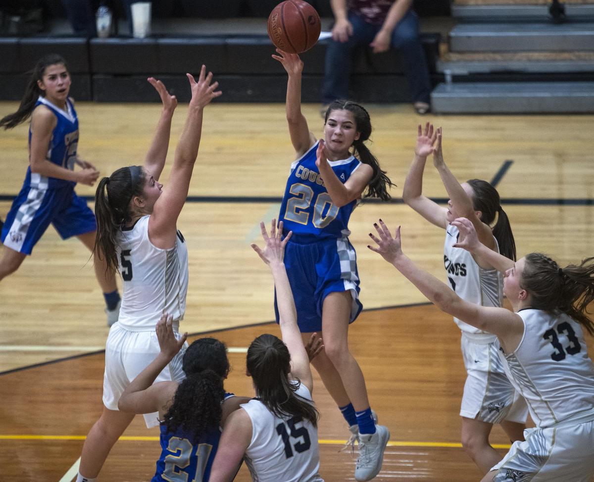 Caldwell point guard Jade Martinez kicks the ball out of pressure against Middleton in the 4A Distric Three championship game last winter.