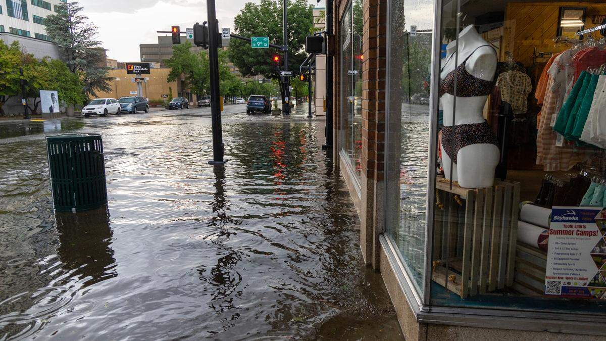 Water pools in front of businesses in downtown Boise during a flash thunderstorm on Tuesday.