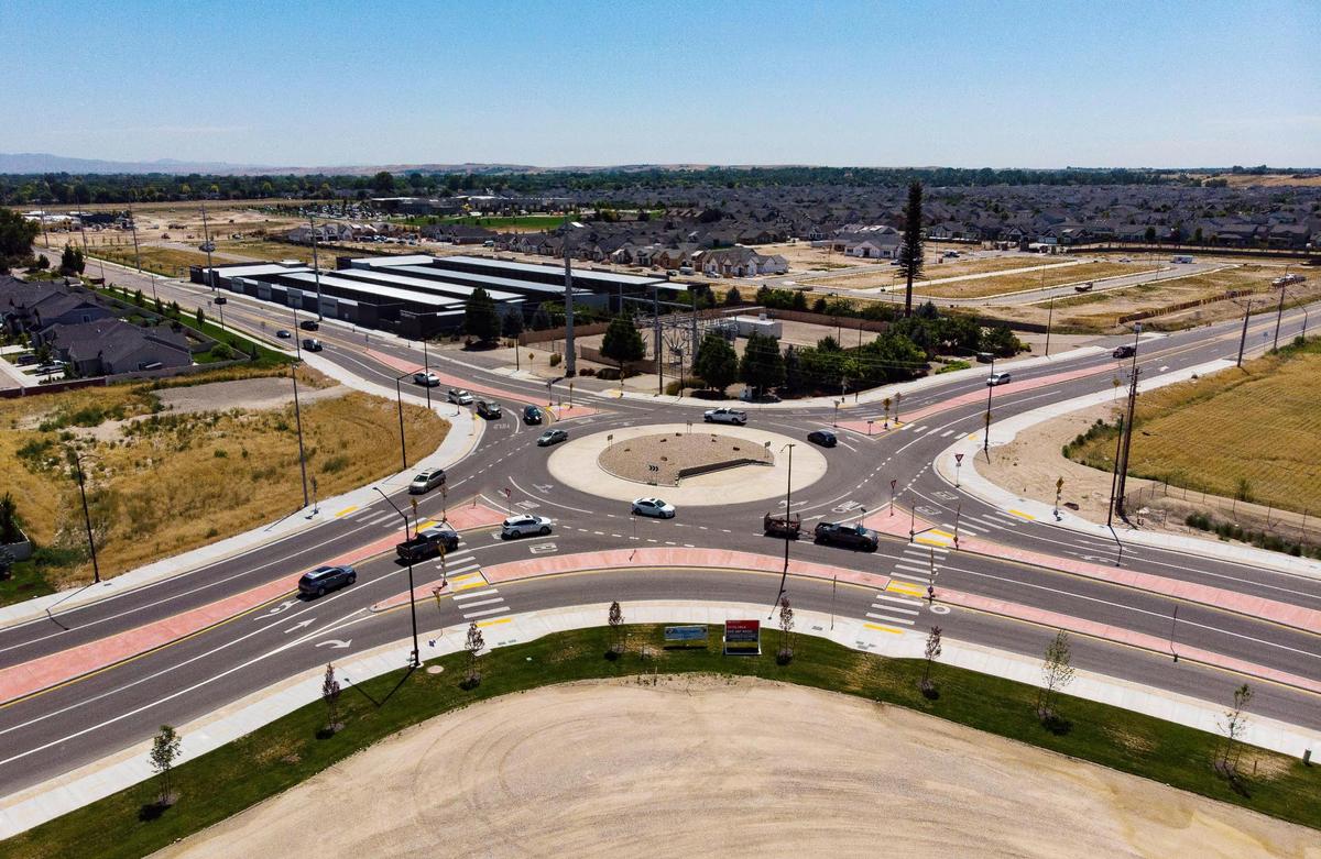 Vehicles navigate the dual-lane roundabout at Eagle and Amity roads, which opened in October 2021.