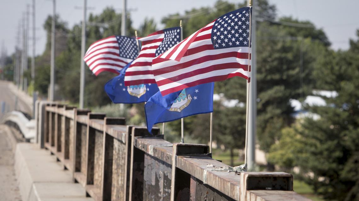 U.S. flags on I-84 overpass served as memorial. Boise police say some were spray-painted