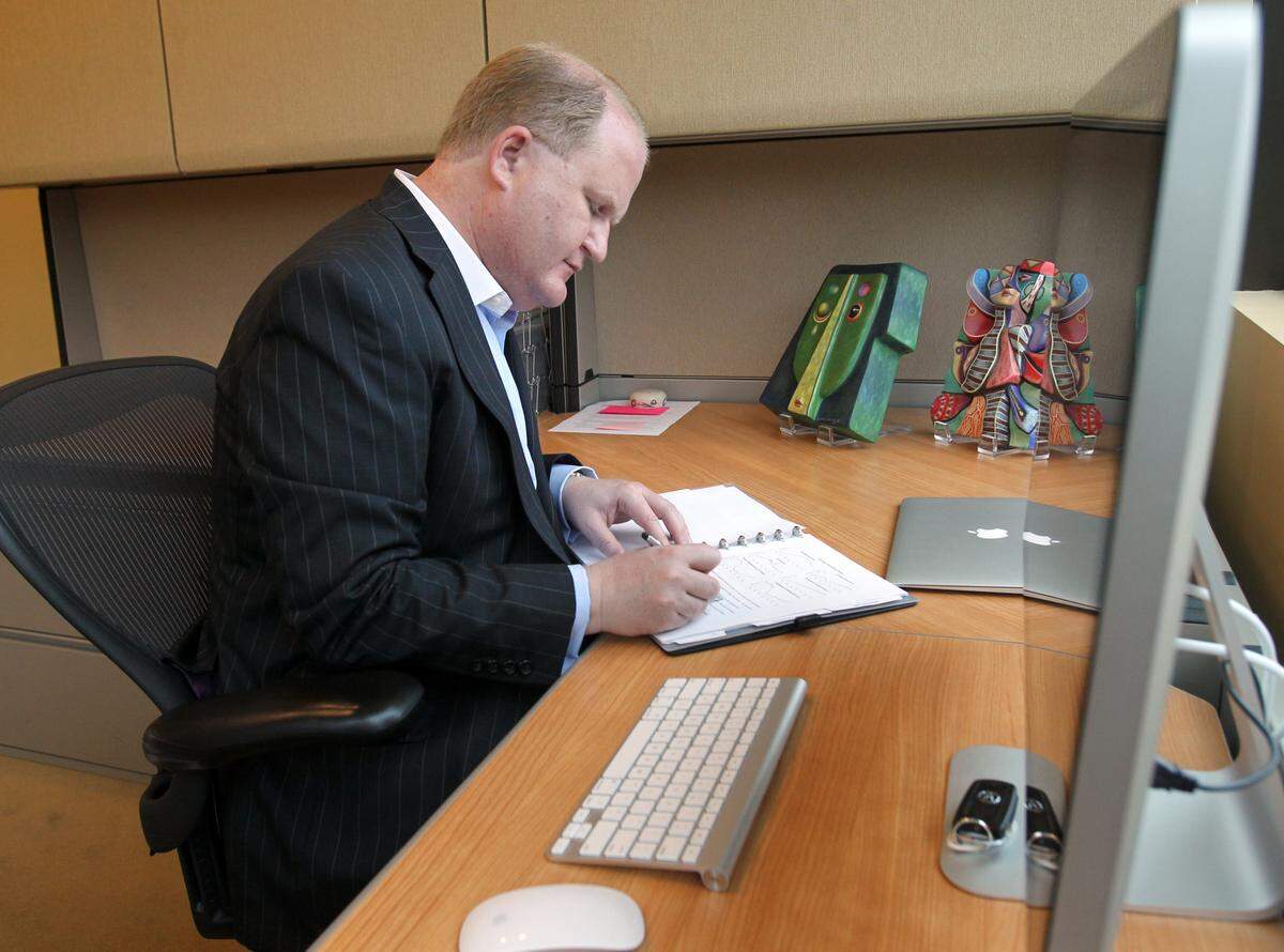 Keynetics CEO Brad Wiskirchen works in his office in his company’s three-story building on Lusk Street in May 2013. Keynetics is a holding company whose subsidiaries including Kount. Kount software identifies, tracks, and foils fraudulent credit card orders for about 300 companies. By 2013, it boasted annual revenue of more than $400 million. 