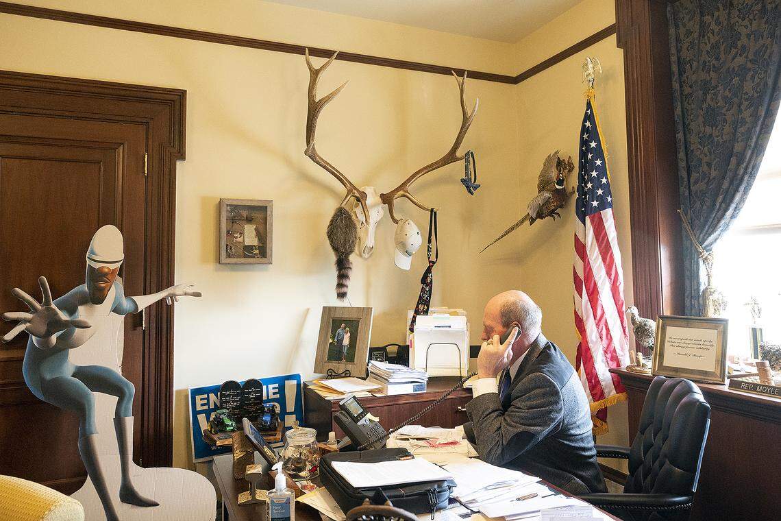 A cutout of Frozone, a character in the Pixar movie “The Incredibles,” sits in Rep. Mike Moyle’s office as he answers phone calls. Moyle was given the cutout as a reference to a bill he proposed that would have frozen property taxes for one year. The bill passed the House but was defeated in the Senate.