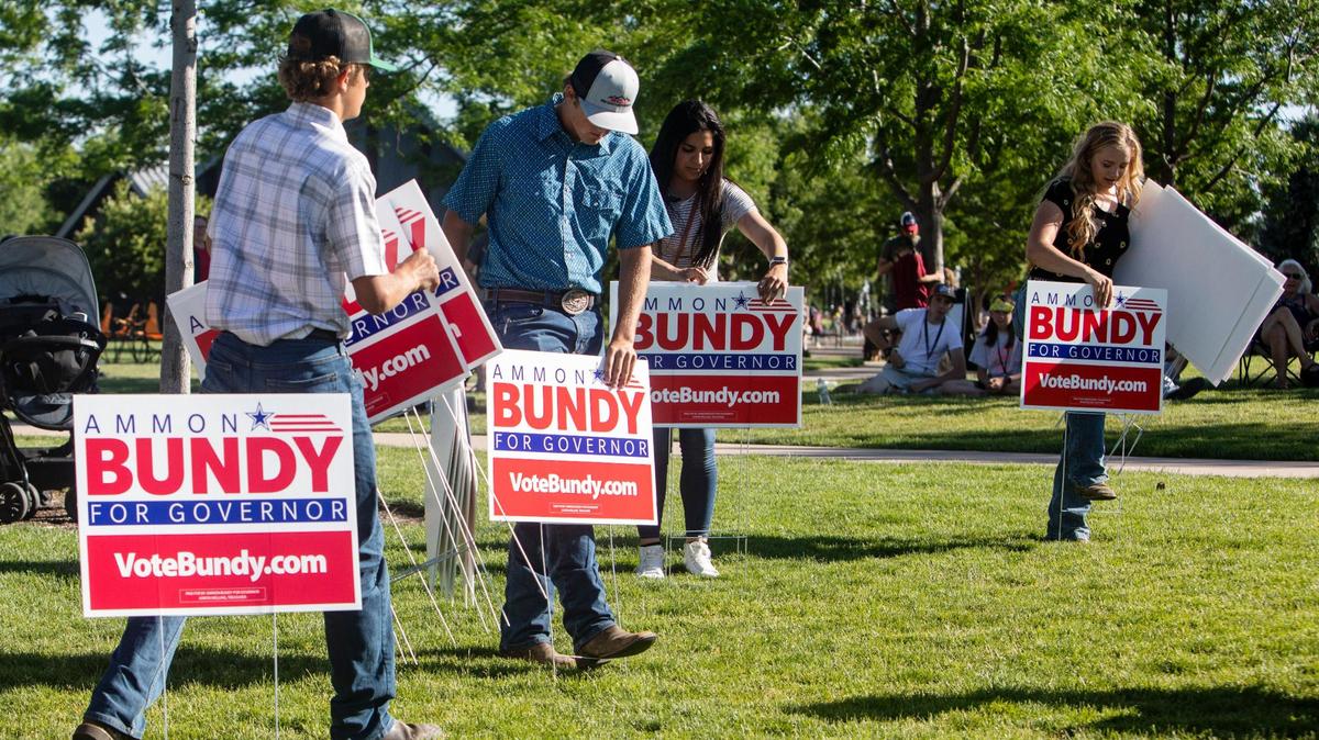 Volunteers put out campaign signs as Ammon Bundy announces his run for Idaho governor during an event at Kleiner Park in Meridian on Saturday. Bundy announced his key campaign issues, including the elimination of property tax and income tax and taking control of all federal land in Idaho.