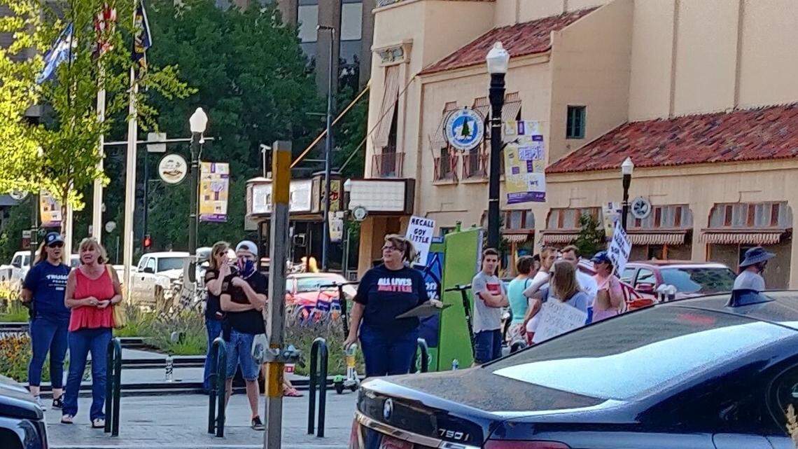 A small crowd gathered to protest across the street from Dharma Sushi & Thai on July 26 after an online video showed restaurant employees asking an unmasked customer to leave the business. Some participants wore Trump shirts, and others held “Recall Gov. Little” signs.