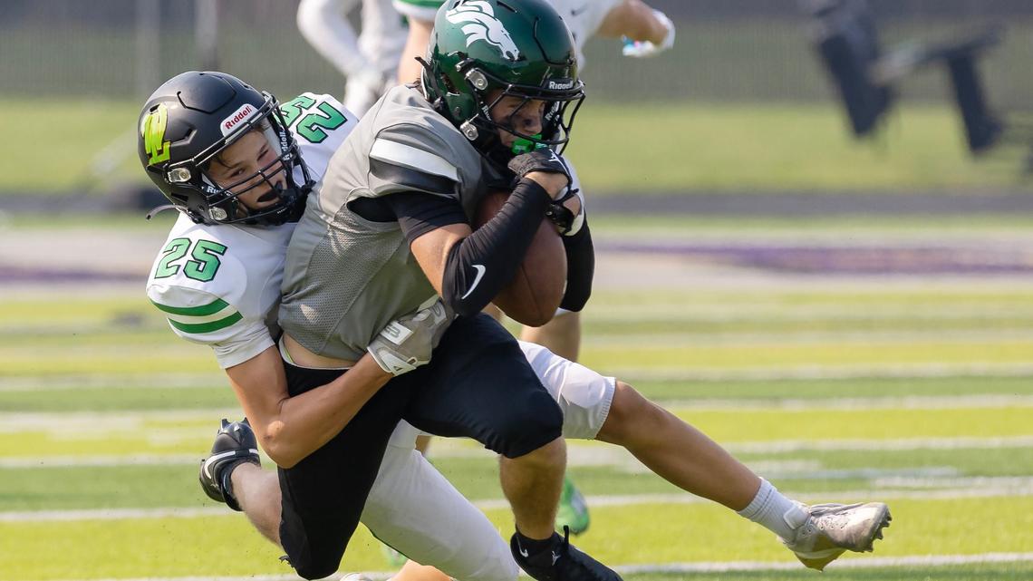 Eagle defensive back Aaron Zrno is tracked down by Oregon’s West Linn cornerback Tyson Donnerberg on Saturday in the Northwest Showdown held at Rocky Mountain High.