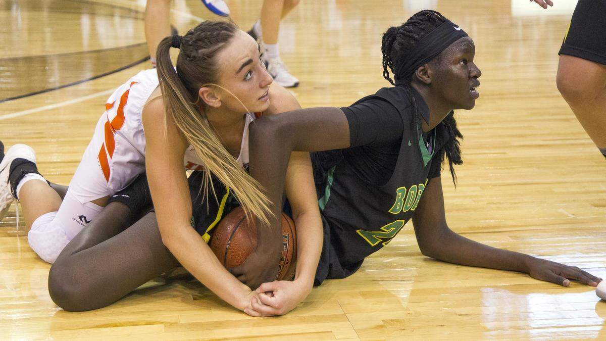 Borah’s Nyalam Thabach gets tied up with Post Falls’ Bayley Brennan during last season’s 5A state semifinals.