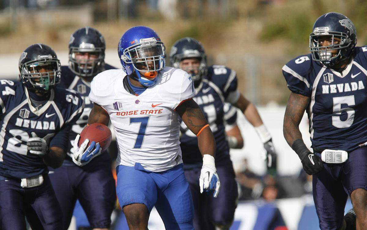 D.J. Harper #7 of the Boise State Broncos heads upfield against University of Nevada at Mackay Stadium in Reno, NV on December 1, 2012.