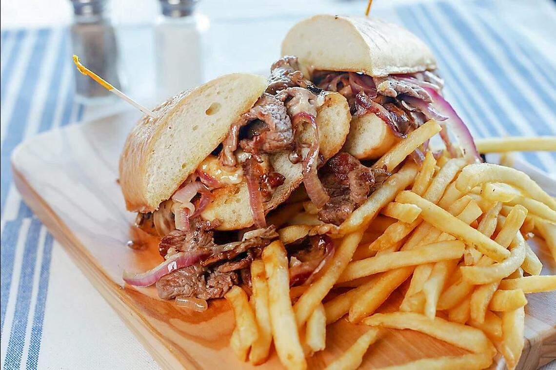 The Prime Steak Sandwich ($14.29) is thinly sliced top sirloin with sauteed mushrooms, Hog Sauce, bacon jam, pickled red onions and melted sharp cheddar cheese on a toasted French roll.