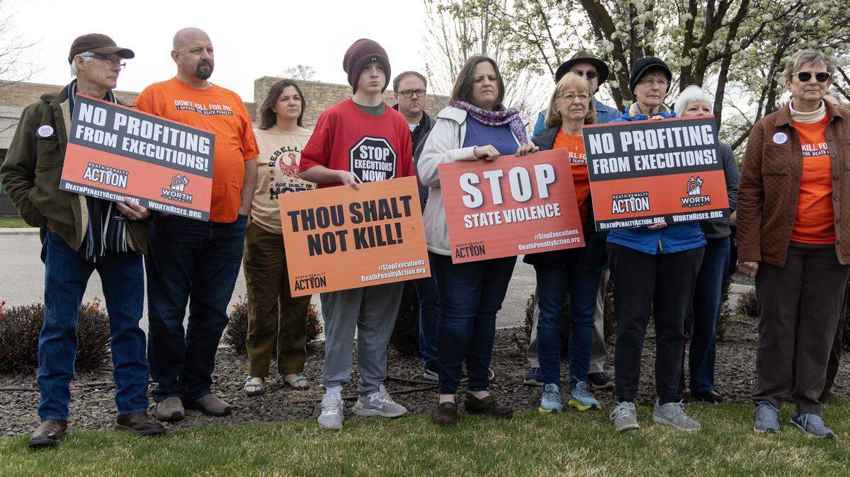 People against the death penalty gather outside of Cator Ruma and Associates, Tuesday, March 31, 2026. Cator Ruma and Associates is a Boise engineering firm contracted to design Idaho's new firing squad execution chamber.