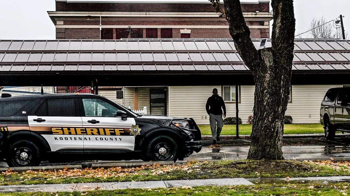 A sheriff’s deputy walks away from the scene where police shot and killed S.A. Floyd in Spirit Lake on Nov. 1.