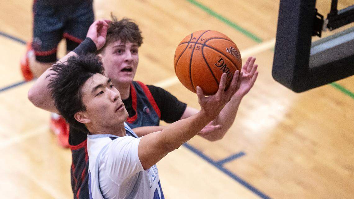 Timberline senior Alex Ko scores during a district tournament game against Boise on Feb. 18. Ko and the Wolves face Meridian at 7 p.m. Thursday at the Ford Idaho Center in the first round of the 6A state tournament.