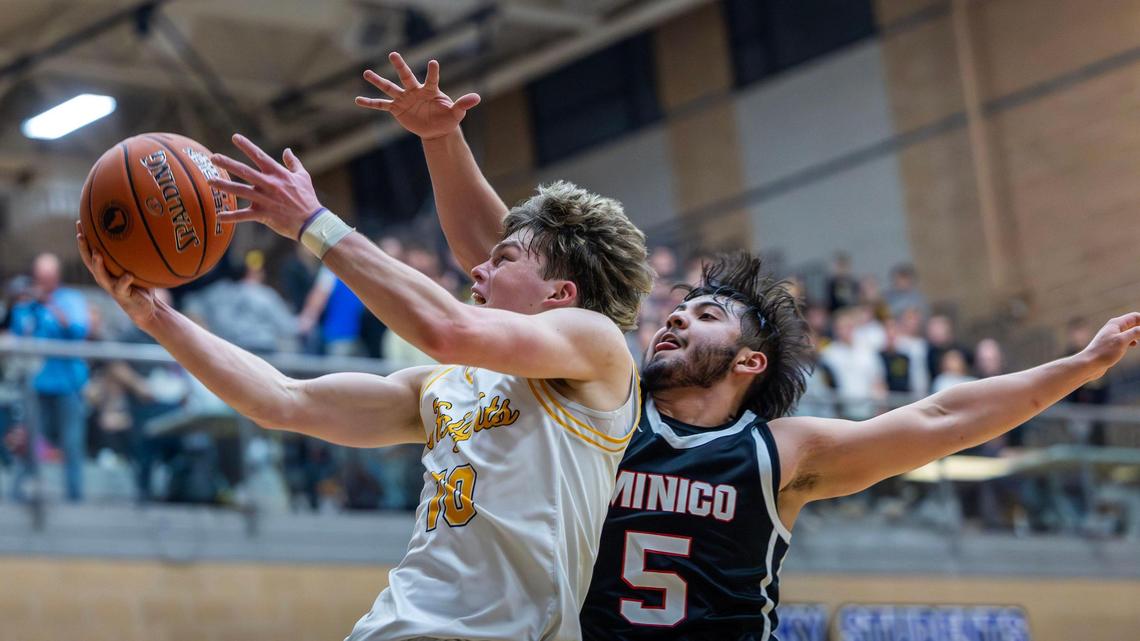 Bishop Kelly guard Owen Kane, left, scores on a fast break during the 4A state tournament last February at Rocky Mountain High School in Meridian.