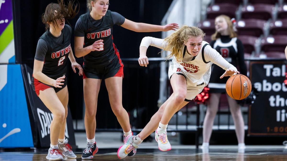Boise’s Avery Howell, right, lunges for a loose ball in the first round of the 5A girls basketball state tournament. Boise beat Owyhee 59-47 on Thursday at the Ford Idaho Center to advance to the semifinals.