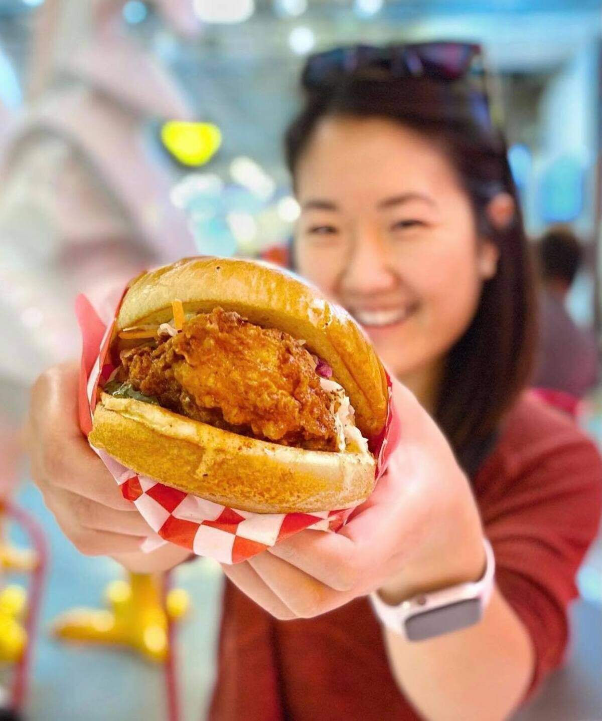 The signature Bang Bang sandwich consists of deep-fried chicken with sweet garlic soy or sweet chili sauce, topped with Comeback Sauce, butter ranch, coleslaw and pickles.