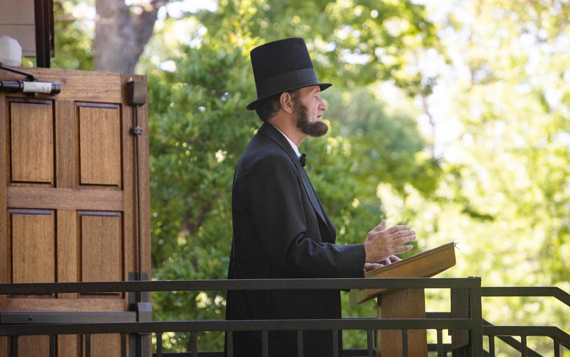 Attendees listen as Abraham Lincoln presenter Skip Critell of Boise gives a history of Lincoln, the Civil Rights movement, and recollections of his personal life as a child living in the South, during a Juneteenth celebration at the Idaho Black History Museum in Boise on Saturday, June 19, 2021. Juneteeth was made a federal holiday this year.