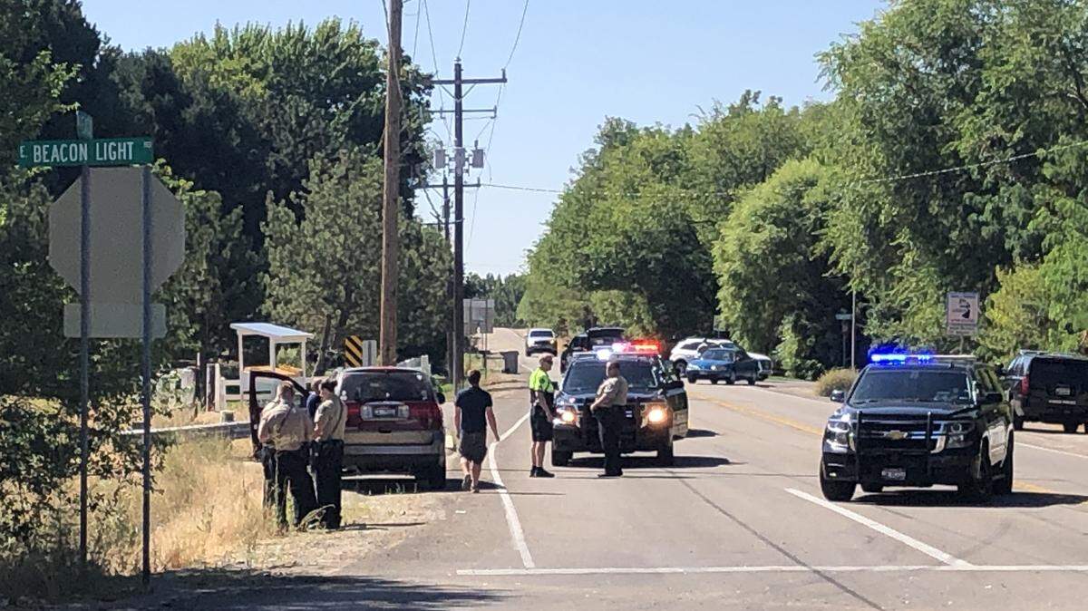 Police investigate a crash involving a bicycle and two vehicles on Eagle Road at Beacon Light Road Friday.
