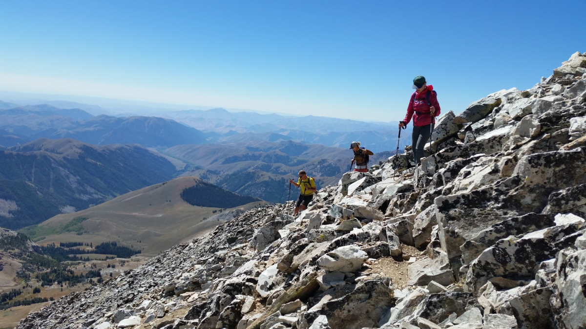 Hikers begin their descent from the top of 12,009-foot Hyndman Peak.