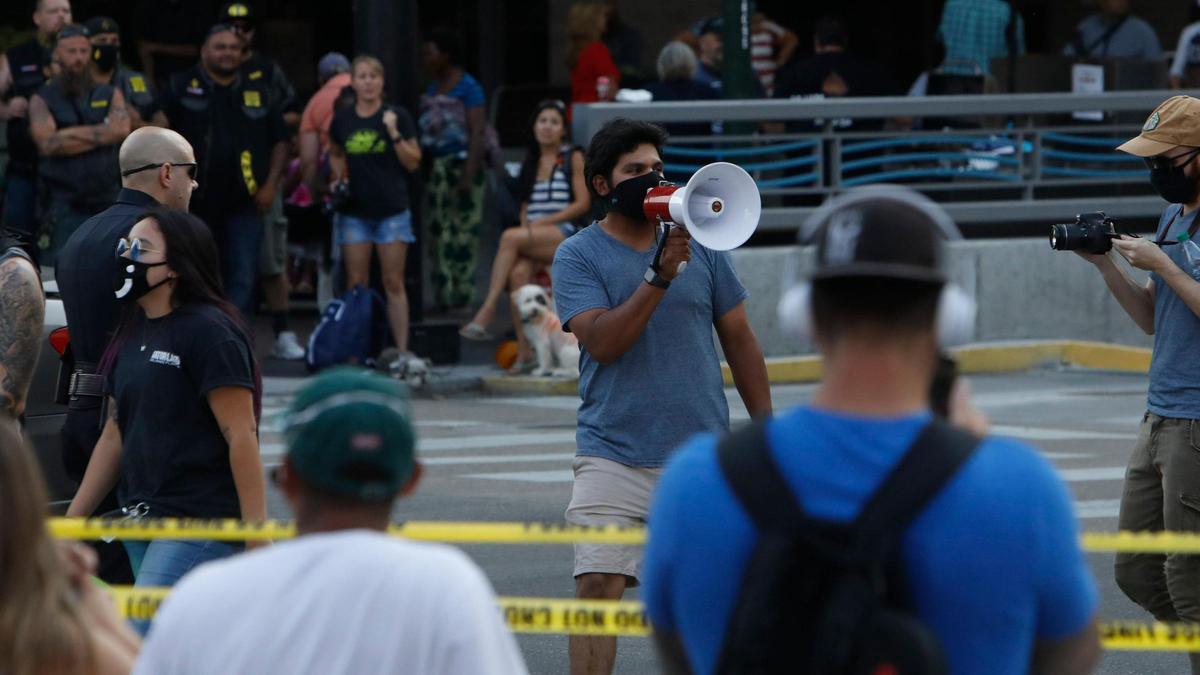 Billy Martinez, a Black Lives Matter Boise supporter, lead chants aimed at Blue Lives Matters protesters at City Hall.