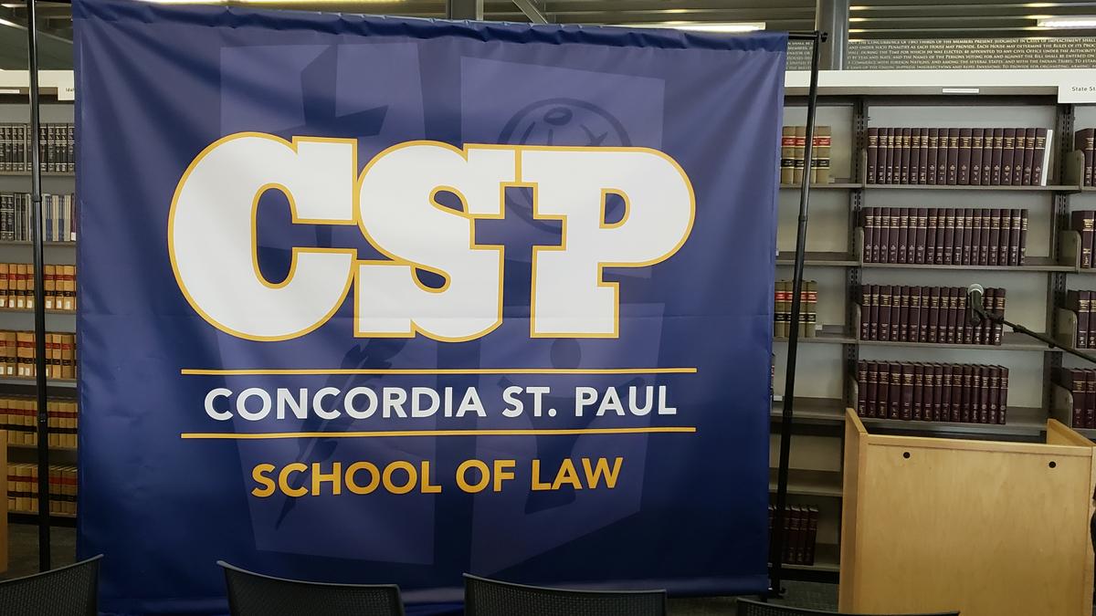 A banner showing Concordia University School of Law’s new name and logo was unveiled during a news conference Thursday announcing the school’s new affiliation with Concordia University St. Paul.