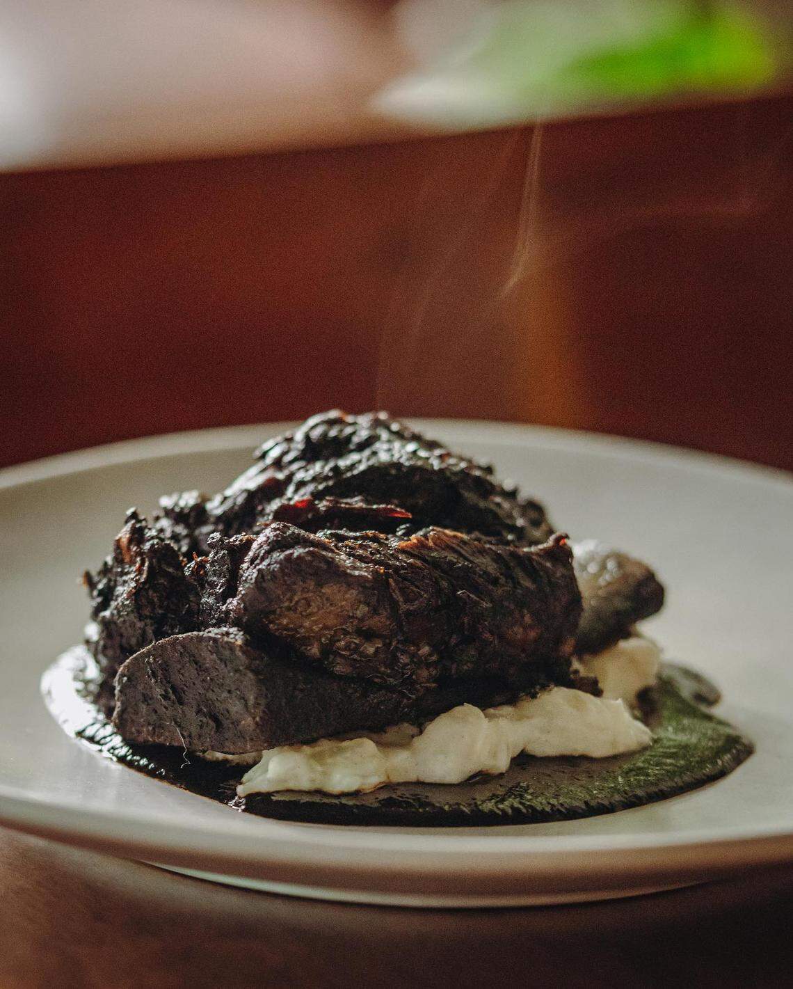 Mole Negro is chef Salvador Alamilla’s “spin on a classic Oaxacan mole, mole negro,” Amano posted on social media. “With mashed yucca and braised short (rib).”