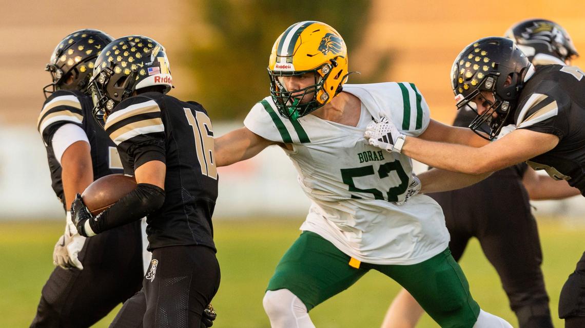 Borah defensive lineman Mason McKenna breaks through for one of his eight tackles-for-loss last season, bringing down Kuna’s Cameron Hickman in the backfield. 