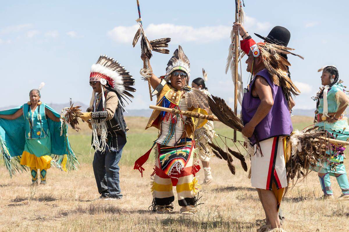 Members of the Shoshone-Paiute Tribes participate in a land blessing ceremony.