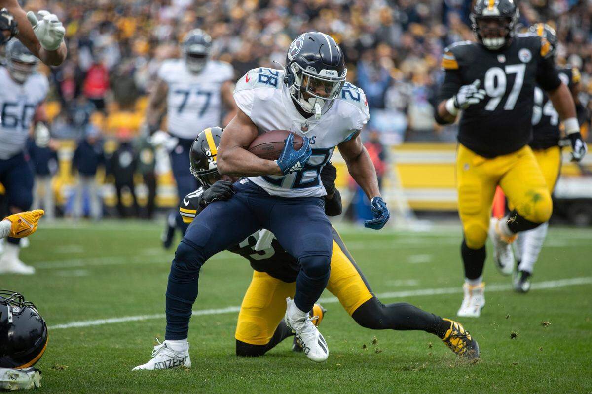 Tennessee Titans running back Jeremy McNichols attempts to evade Pittsburgh Steelers free safety Minkah Fitzpatrick during an NFL football game Sunday in Pittsburgh.