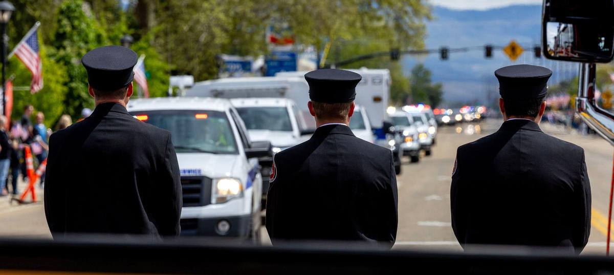 Star Fire Department personnel stand dressed in honor uniforms at the corner of Highway 44 and Star Road. A procession of law enforcement vehicles escorting the body of Ada County Sheriff's Deputy Tobin Bolter, who was killed in the line of duty, passed through Star on its way to Bolter’s funeral at the Ford Idaho Center in Nampa.
