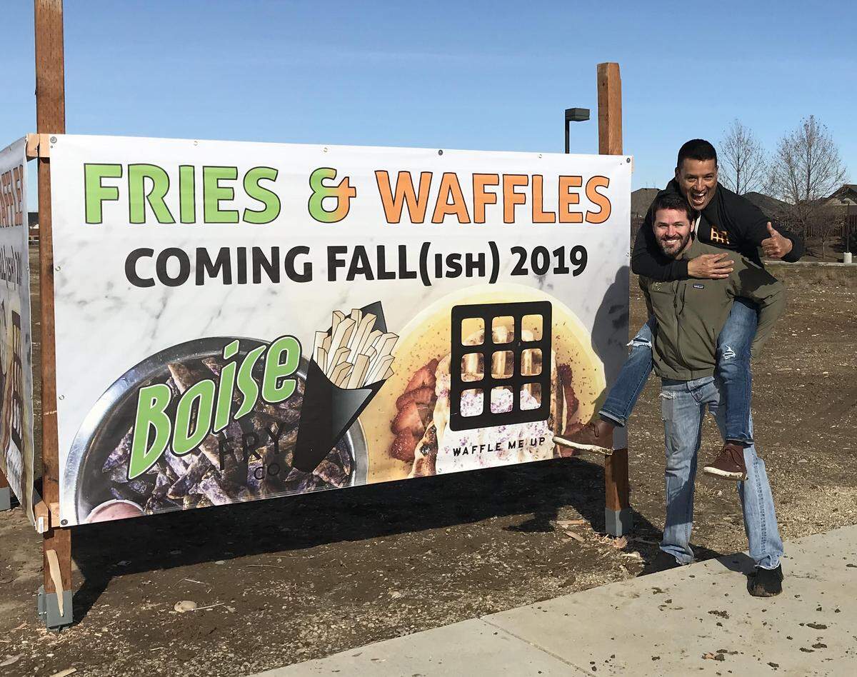 Waffle Me Up owner Hector Garcia rides the shoulders of Boise Fry Co. CEO Brad Walker at the site of their new dual-theme restaurant. It’s at the intersection of Chinden Boulevard and Linder Road.