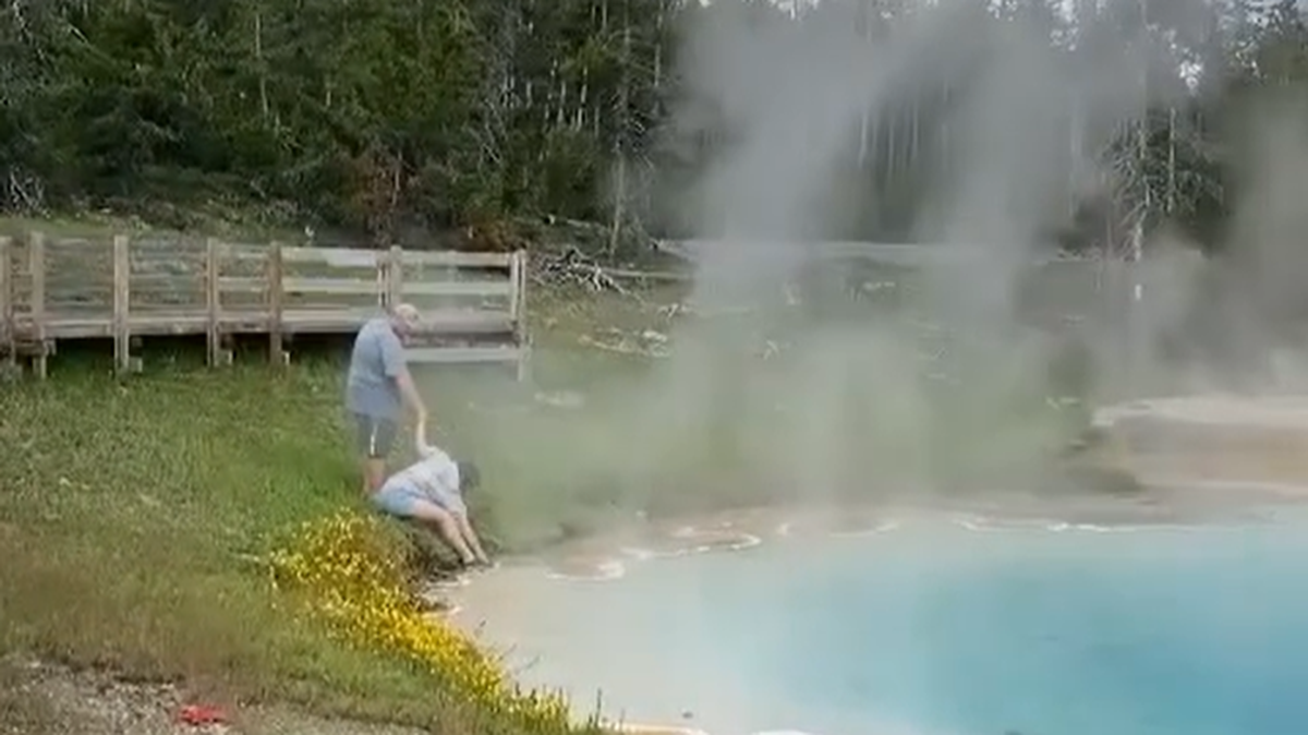 A tourist ignored another visitor’s warning and dipped her fingers into a deadly boiling spring in Yellowstone National Park.