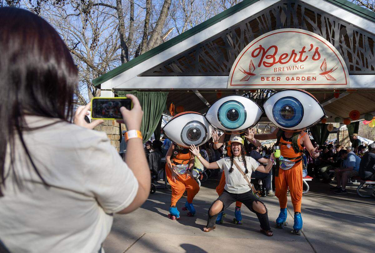 An attendee takes a photo with the iconic roller skating eyeballs at Treefort Music Fest in Boise, March 29, 2026.