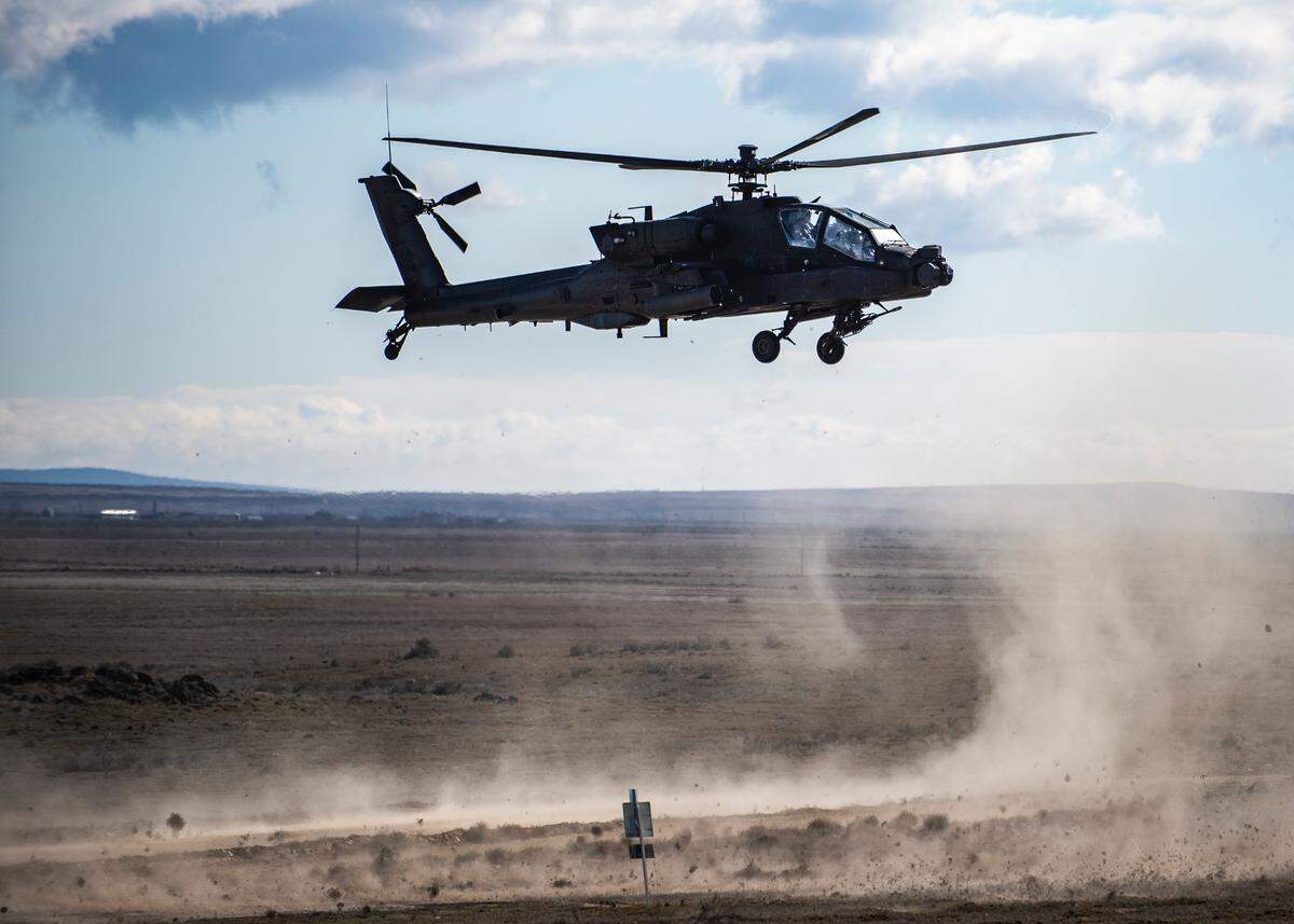 An AH-64 Apache helicopter takes part in an exercise at the Idaho National Guard’s Orchard Combat Training Center south of Boise in 2022.