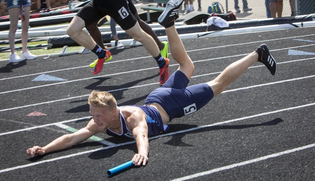 Skyline’s Connor Maloney skids to a stop — but after crossing the line in a first-place finish in the 4A boys 4 x 100 meter relay at the Idaho state track and field championships at Eagle High School on Saturday, May 18, 2019.