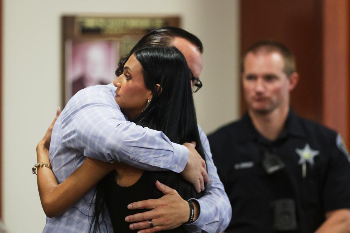 Alivea Goncalves, right, hugs her father, Steve Goncalves, after delivering a victim impact statement at the sentencing hearing of Bryan Kohberger.