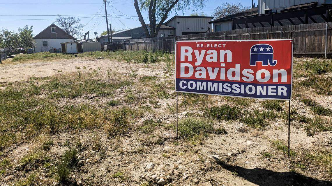 A campaign sign for Ryan Davidson sits on a vacant lot. On Friday, Davidson’s primary opponent, Holly Cook, filed a challenge to his voter registration, which lists that lot.