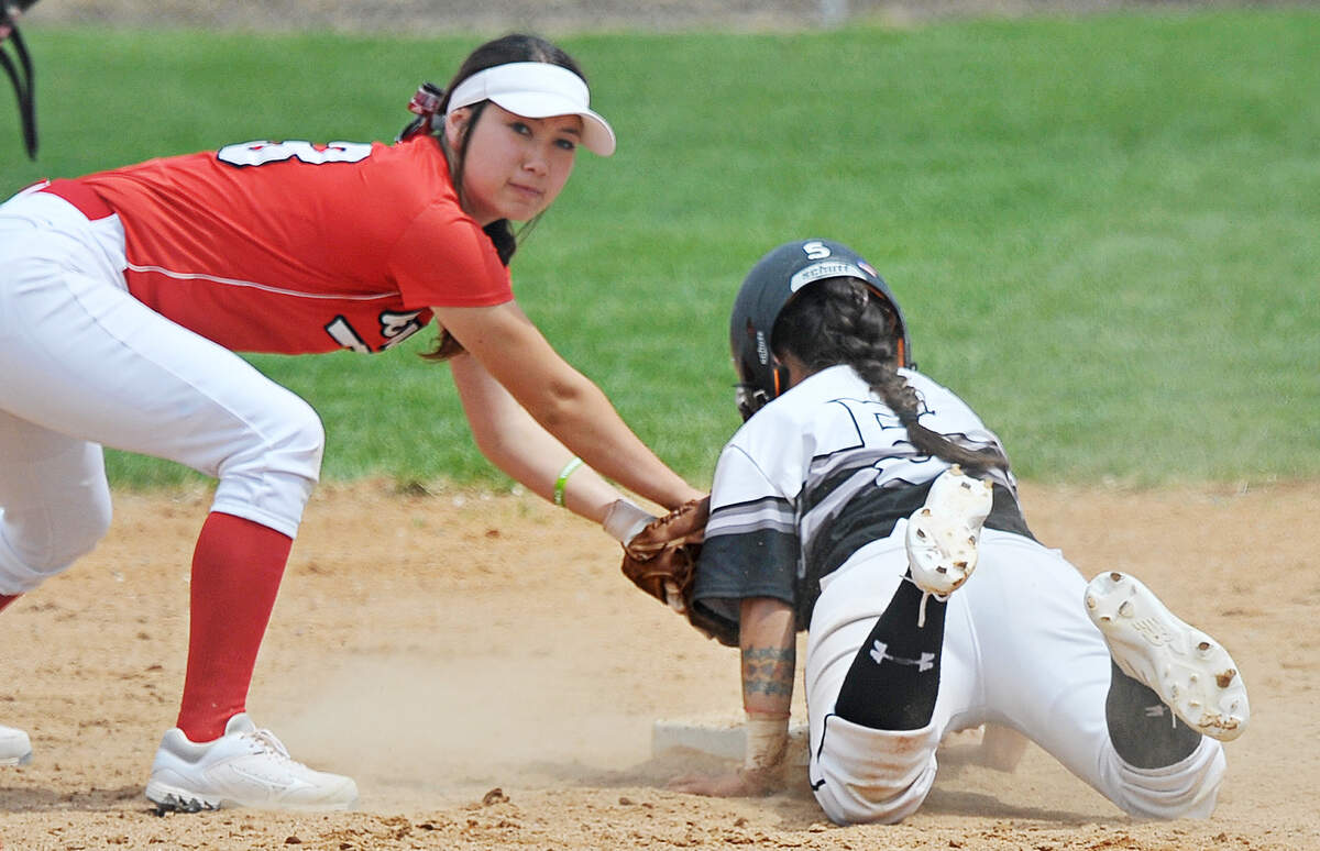 Boise High's Grace Shimatsu tags out a Highland High runner during their 5A softball state tournament first-round game Friday in Pocatello. Shimatsu scored the winning run for the Braves in their state championship victory against Eagle.
