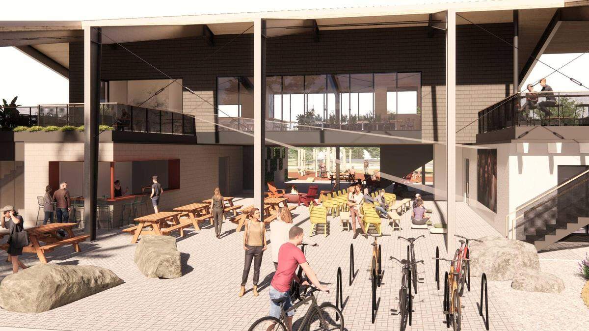 This rendering of the interior of the property show spaces for gathering, bike racks and outdoor seating.